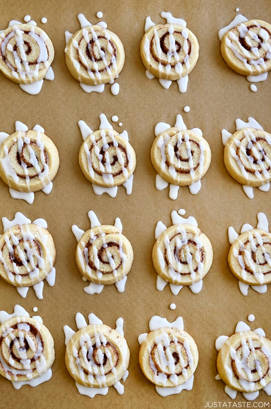 A top-down view of Cinnamon Roll Cookies drizzled with icing