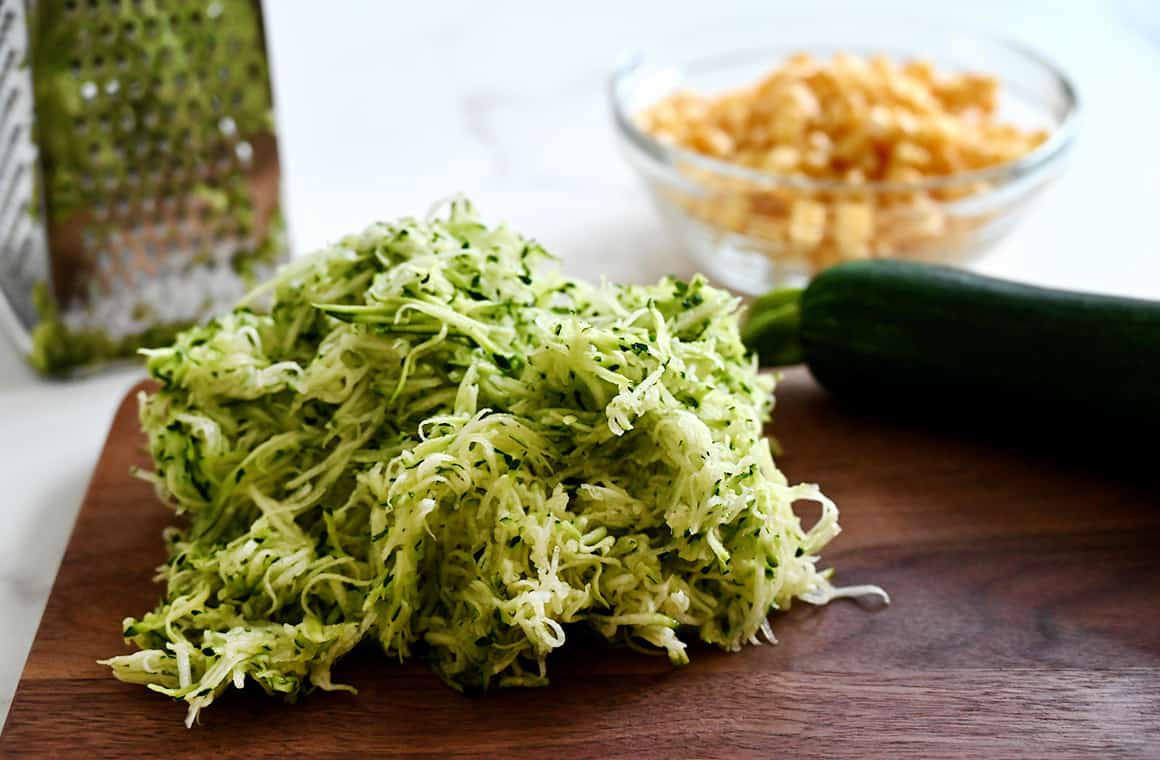 Finely grated squash on a cutting board