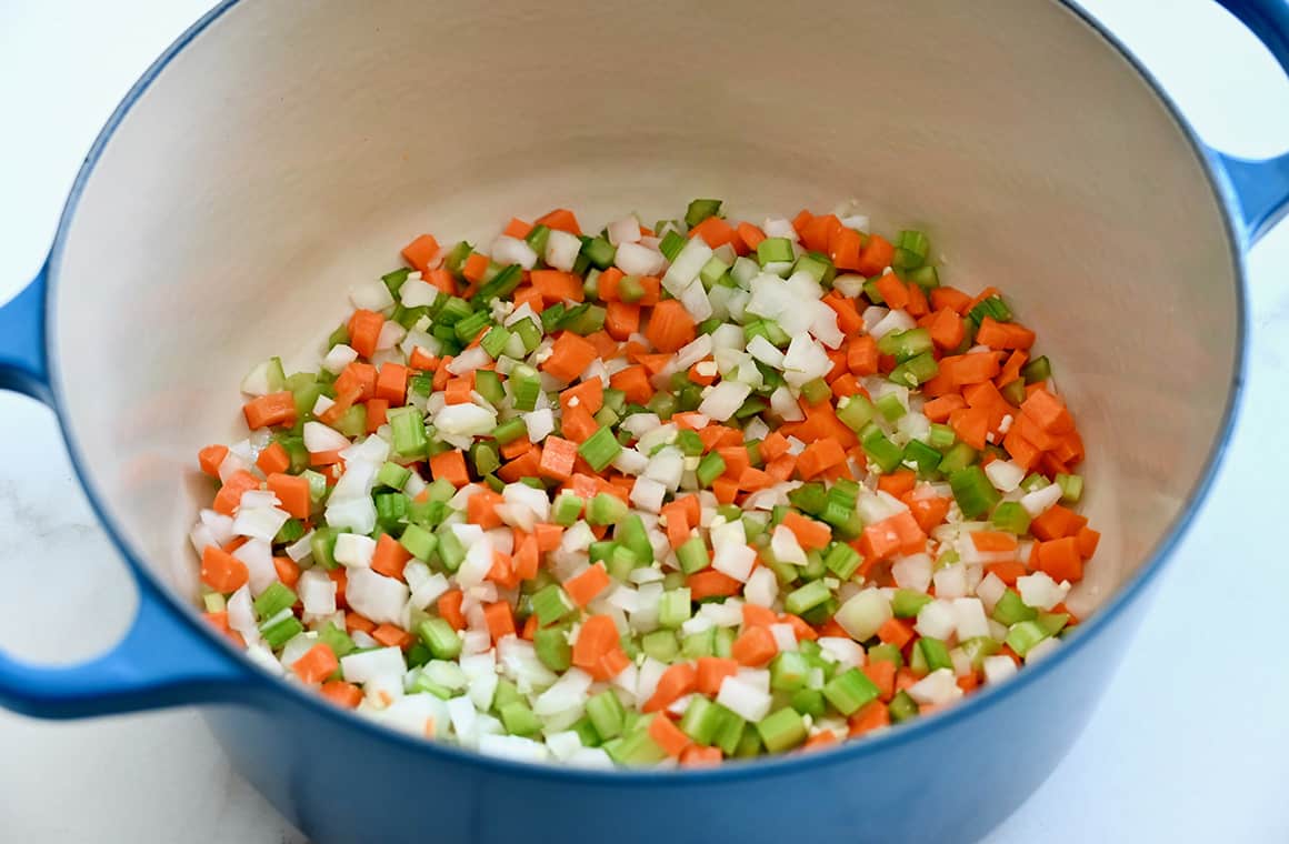 A large stockpot containing mirepoix