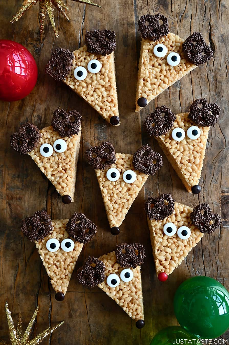 A top-down view of adorable Reindeer Rice Krispies Treats with candy eyes and chocolate-covered pretzels for antlers