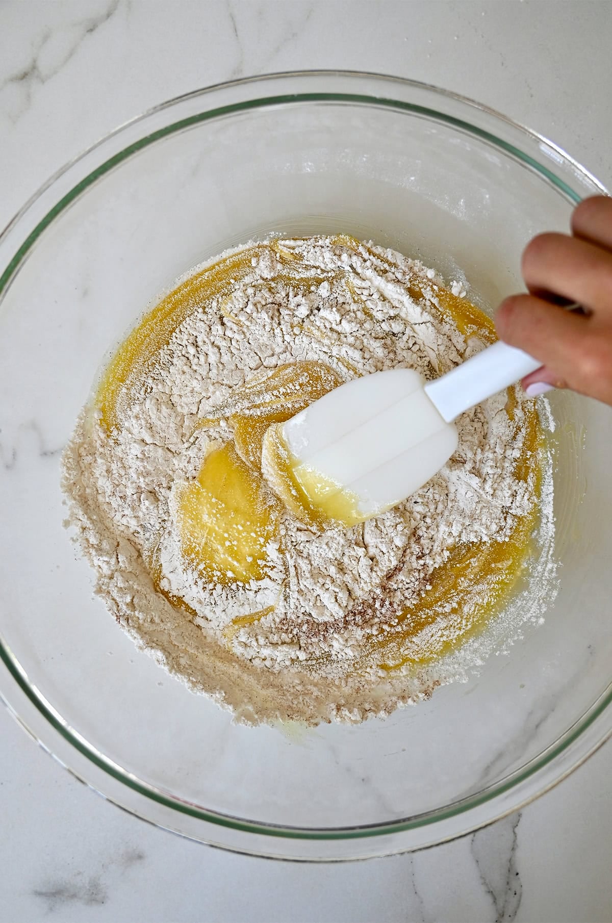 Zucchini muffin batter in a large prep bowl.