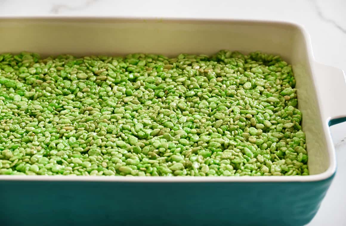 A 13x9-inch baking pan filled with green Rice Krispie treats
