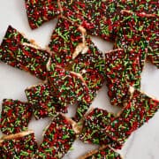 A top-down view of Christmas Saltine Cracker Toffee with lots of festive holiday sprinkles.