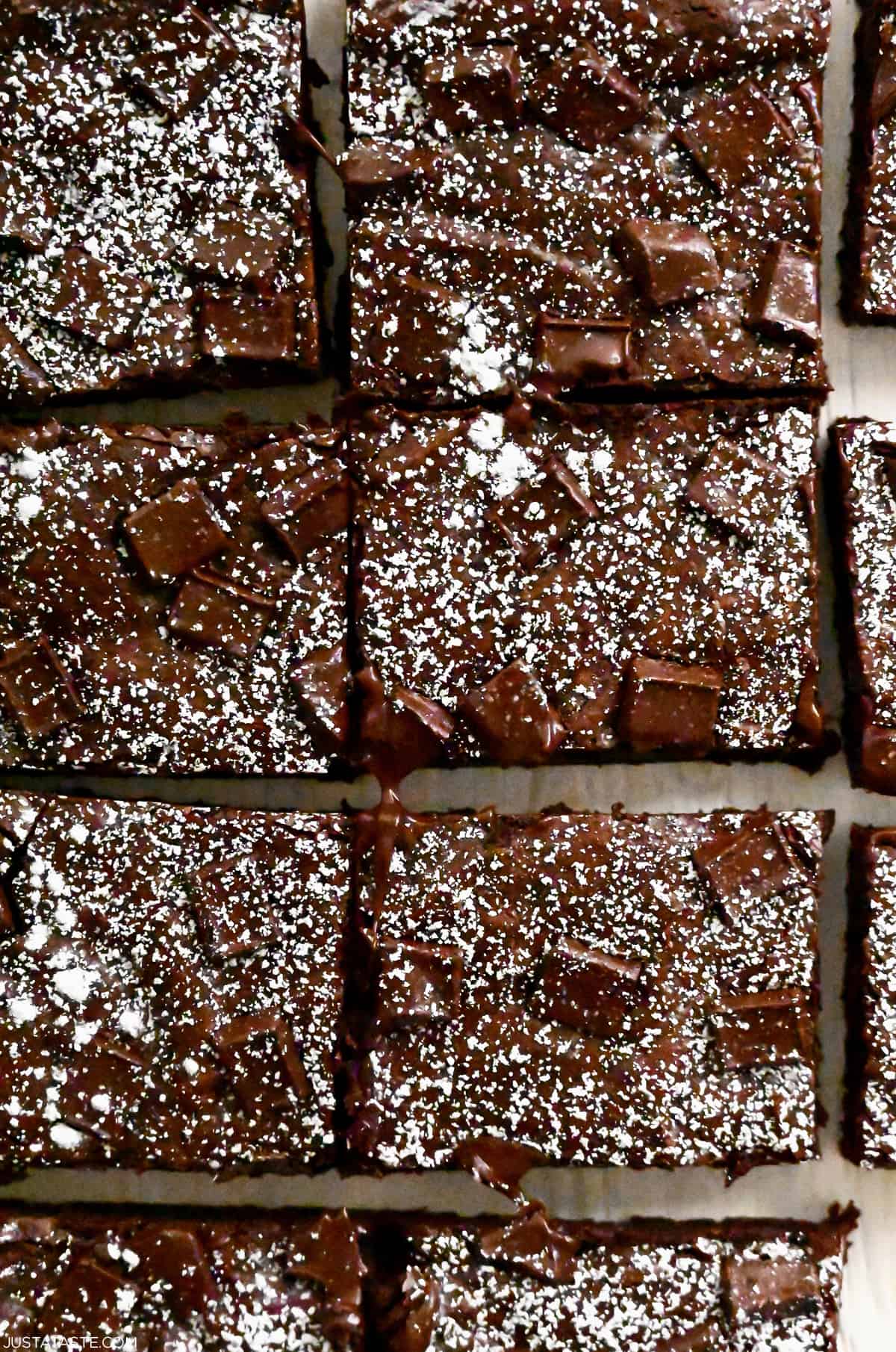 Brownies cut into perfect rectangles and dusted with powdered sugar.