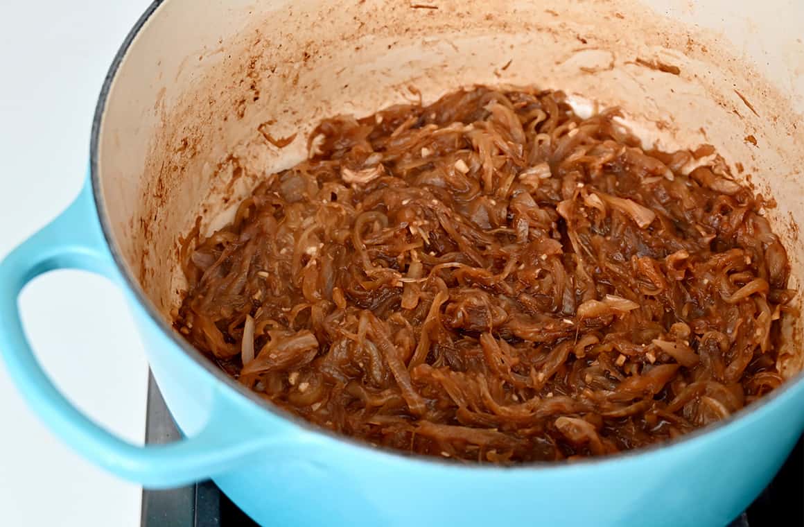 Caramelized onions in a baby blue stockpot