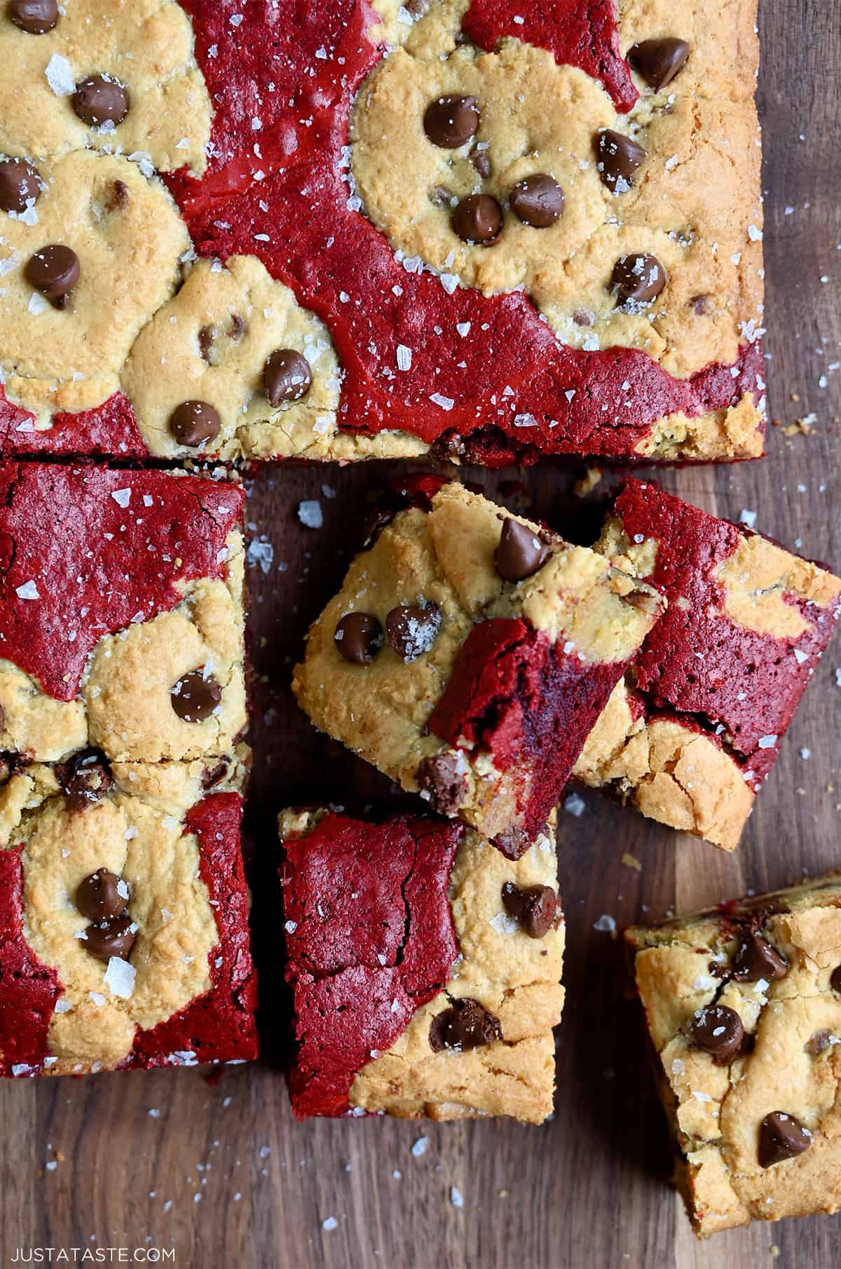 Sliced red velvet brookies studded with chocolate chips and sprinkled with large-flake sea salt.