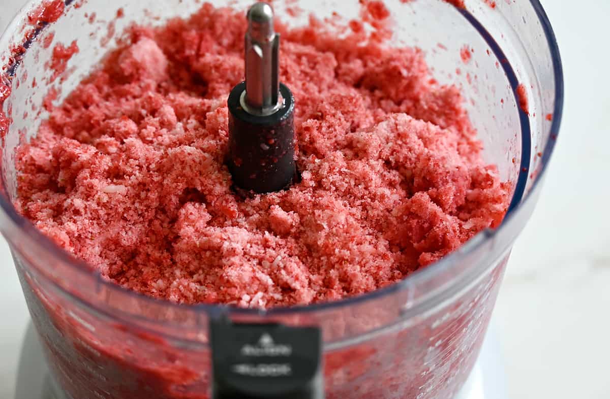 A close up of shaved ice in a food processor