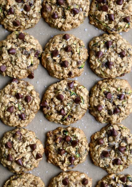 A top-down view of oatmeal zucchini cookies studded with chocolate chips.
