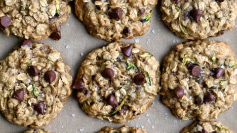 A top-down view of oatmeal zucchini cookies studded with chocolate chips.