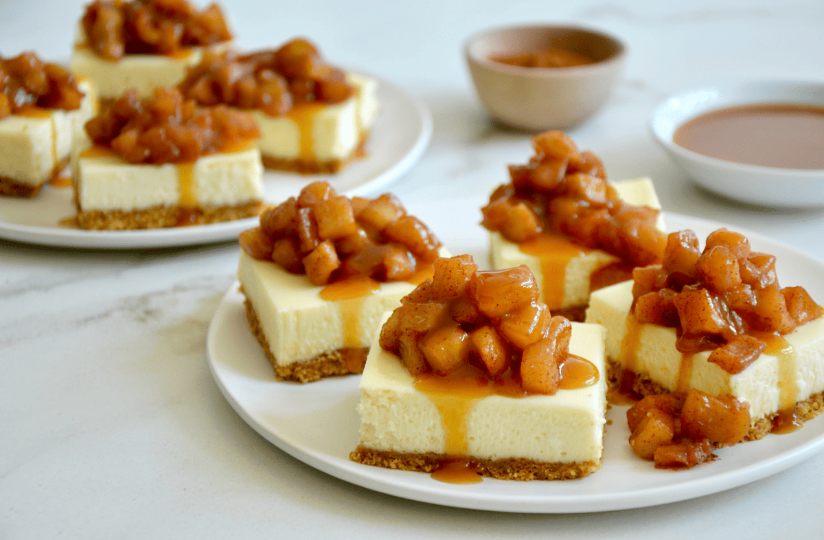 Caramel Apple Cheesecake Bars on White Plate 