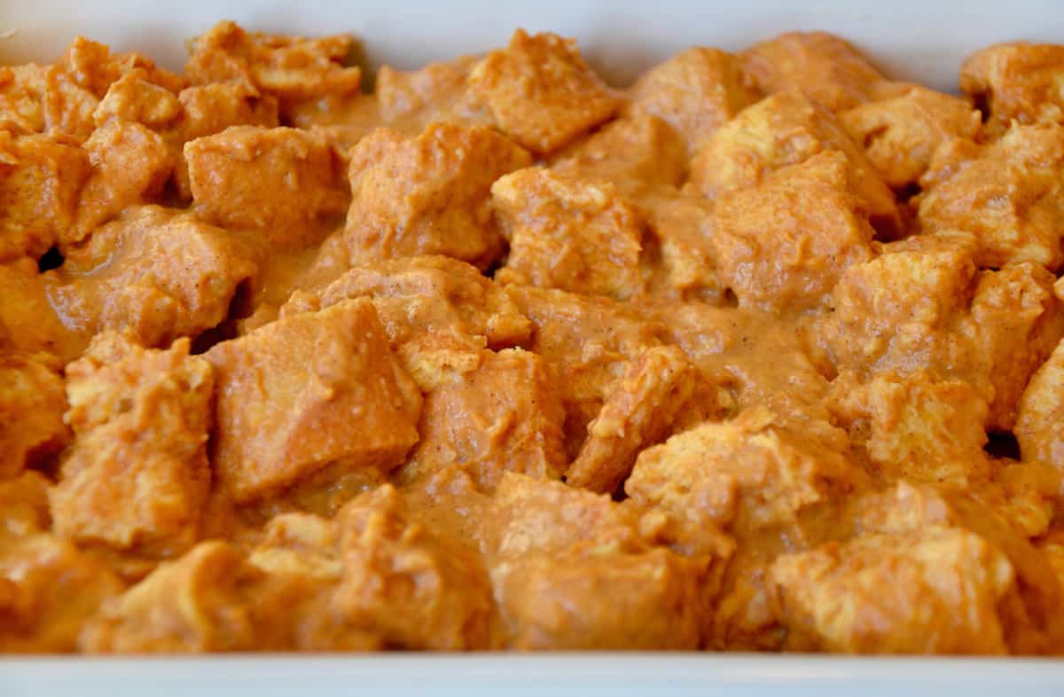 Unbaked pumpkin French toast casserole in a baking dish.