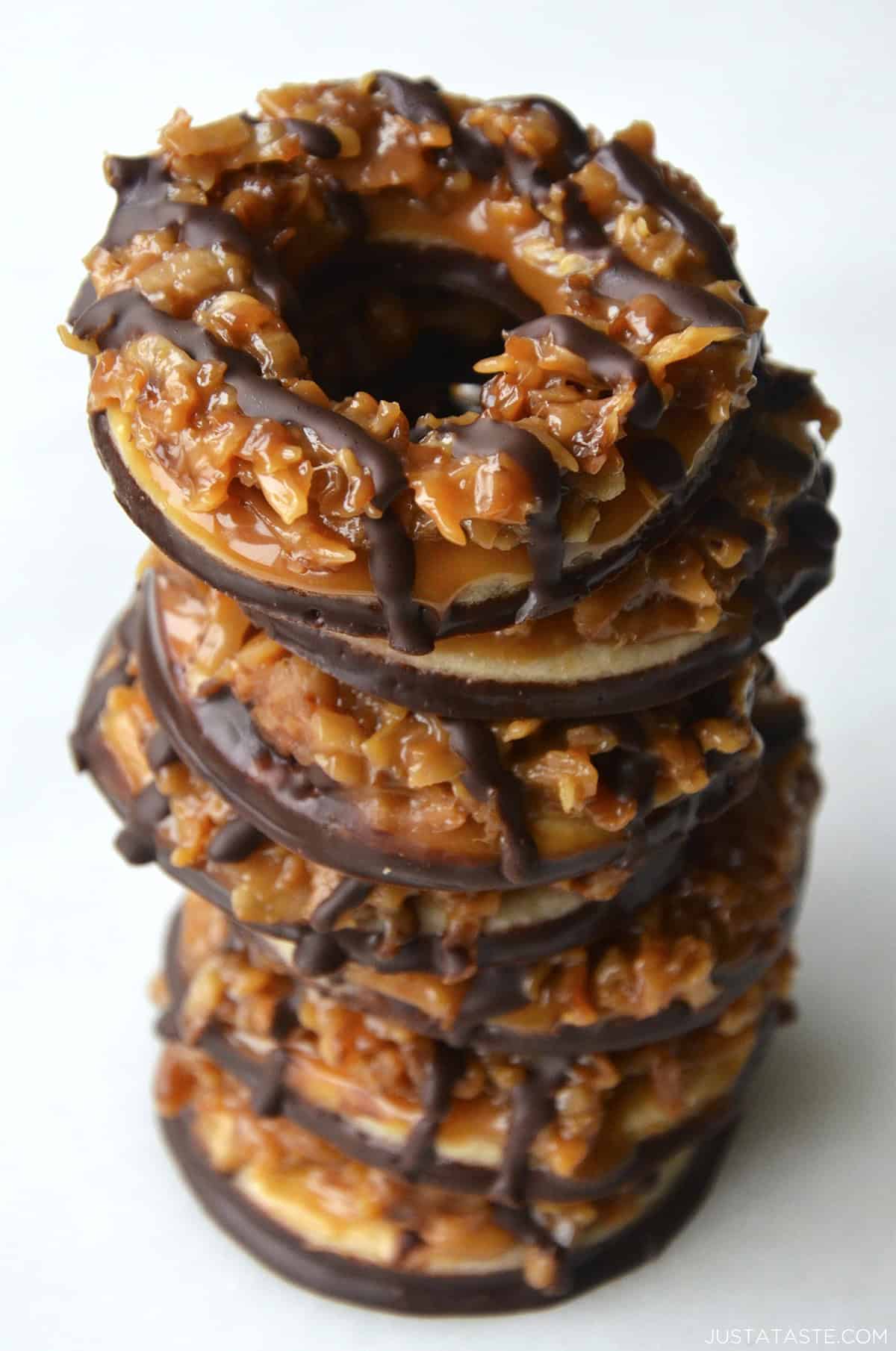Homemade samoas cookies stacked seven high.