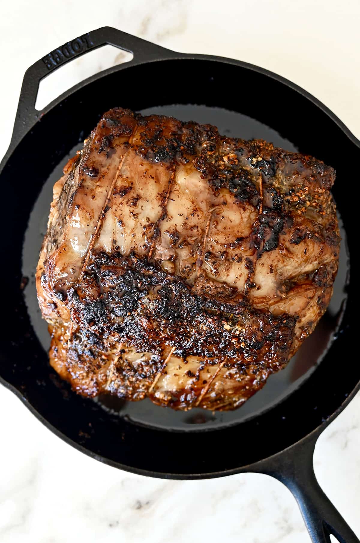 Roasted prime rib in a cast-iron skillet.