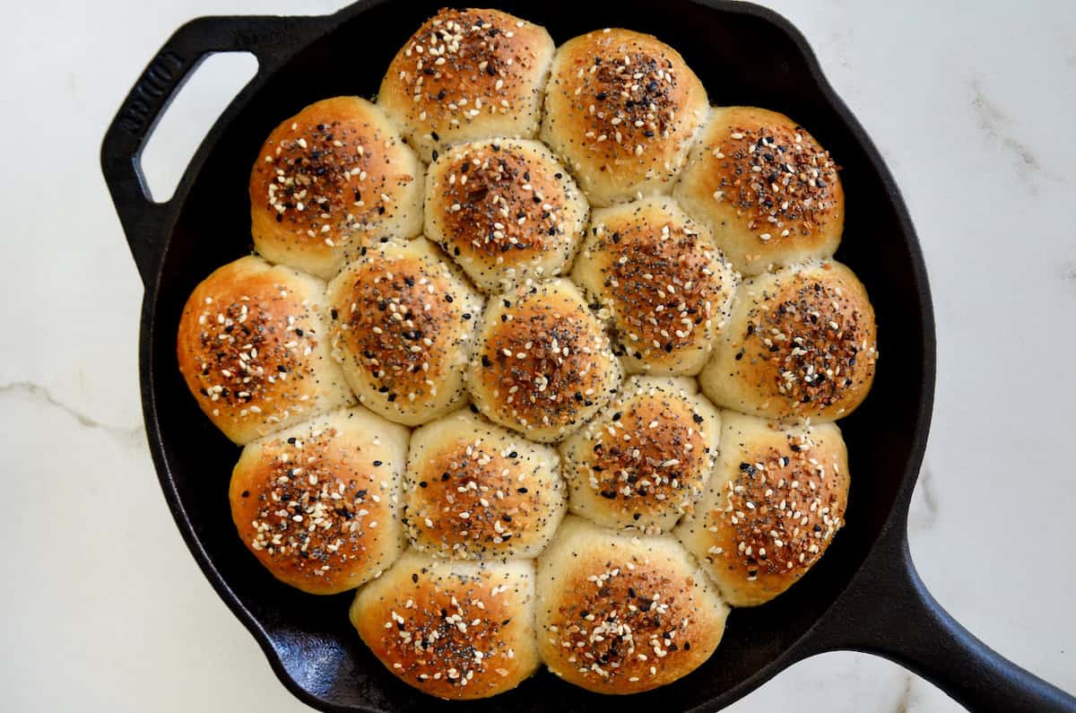 Everything bagel pull-apart bread in a cast iron skillet.