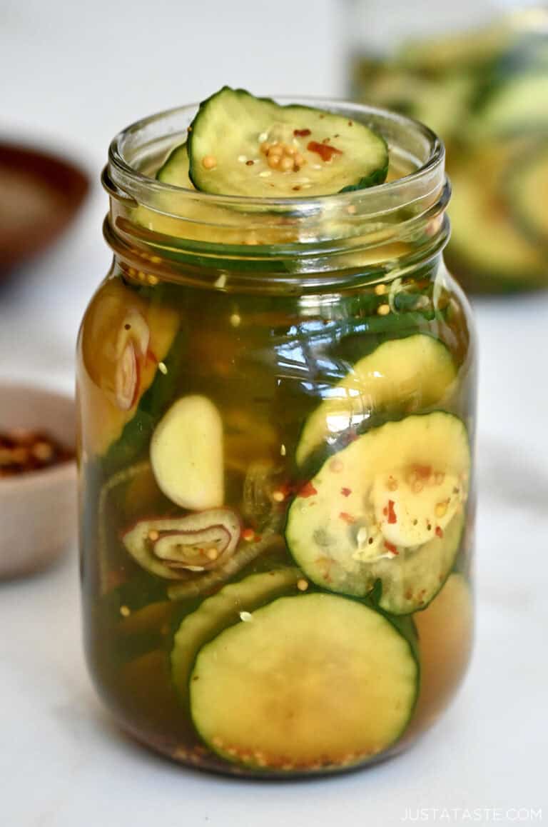 Homemade bread and butter pickles in a Mason jar.