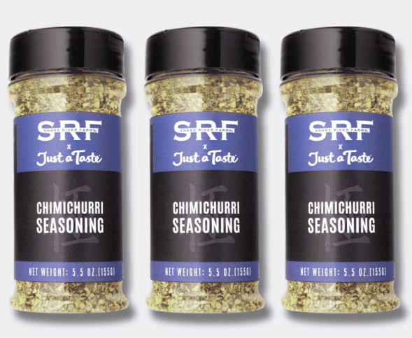 A clear bottle with a purple label and chimichurri seasoning inside