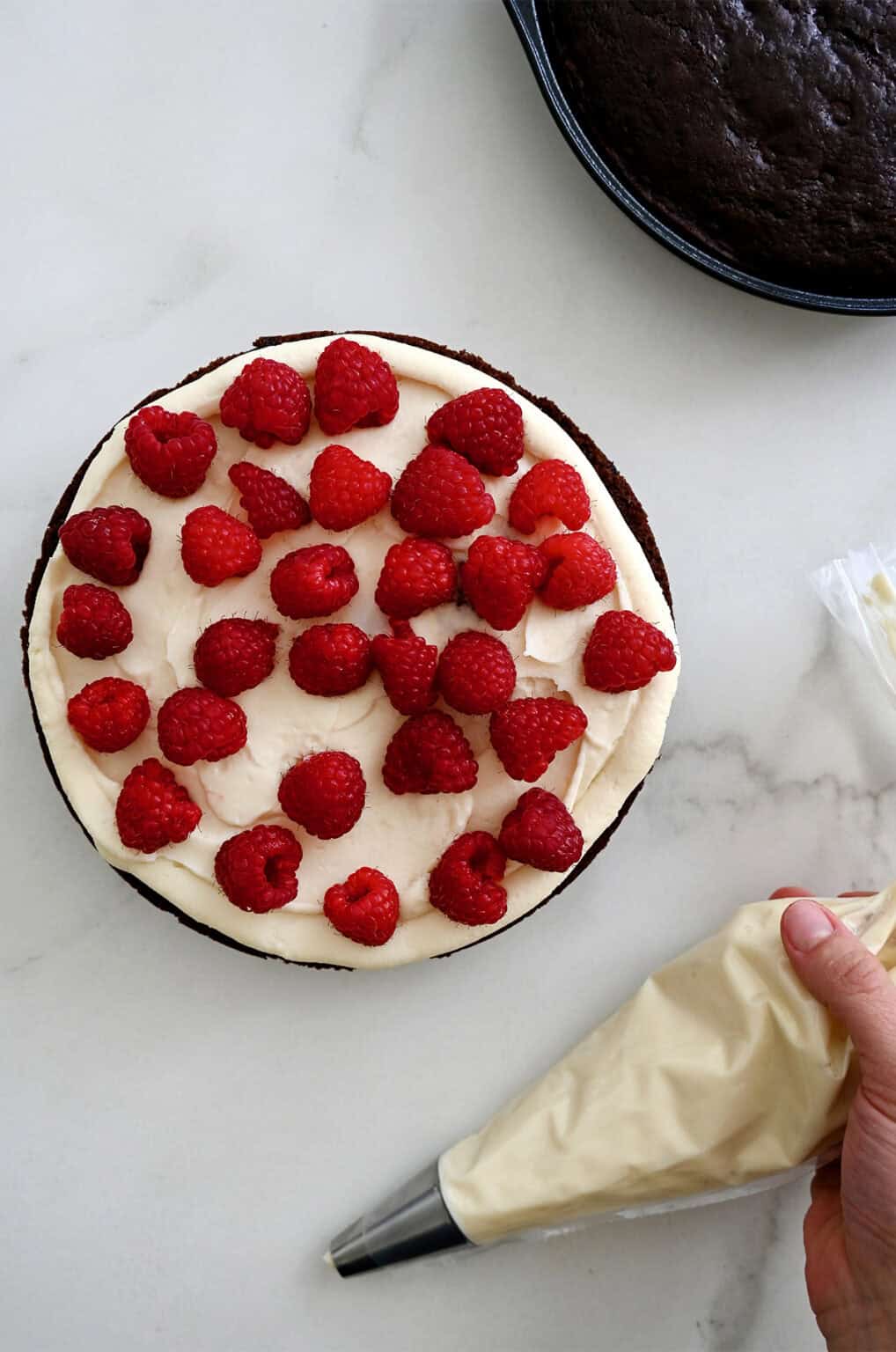 Layering Raspberry Chocolate Raspberry Cake