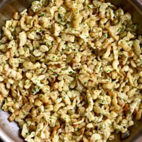 German spaetzle with butter and parsley in a large skillet.
