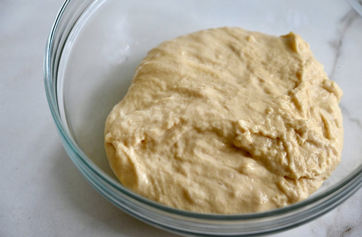 Spaetzle dough in a glass bowl.