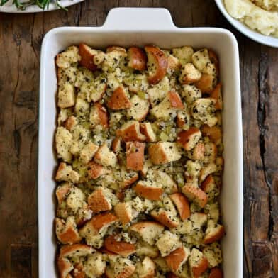 Homemade stuffing in a 9x13 baking dish.