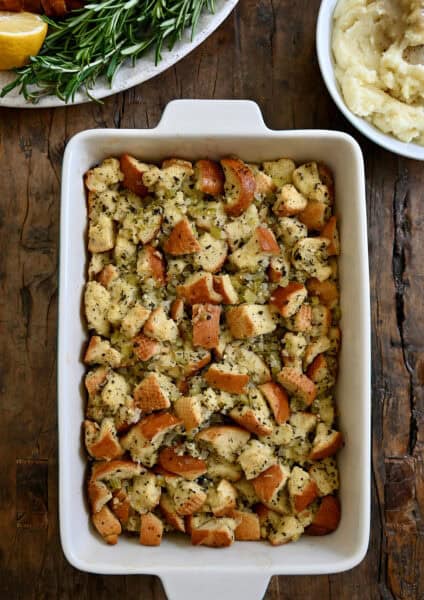 Homemade stuffing in a 9x13 baking dish.