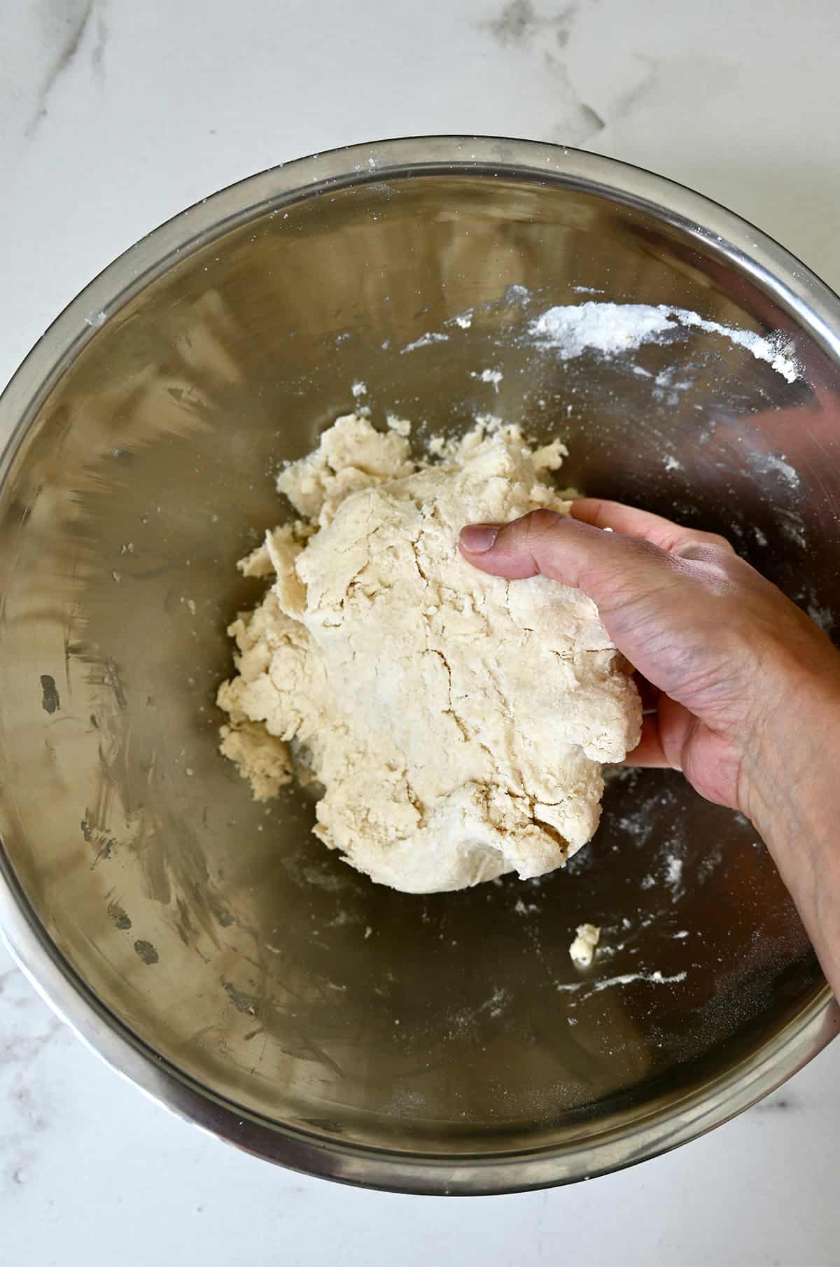 Shaggy pie dough in a bowl.