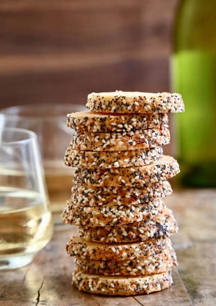 Savory shortbread cookies with everything bagel seasoning stacked 11 high.