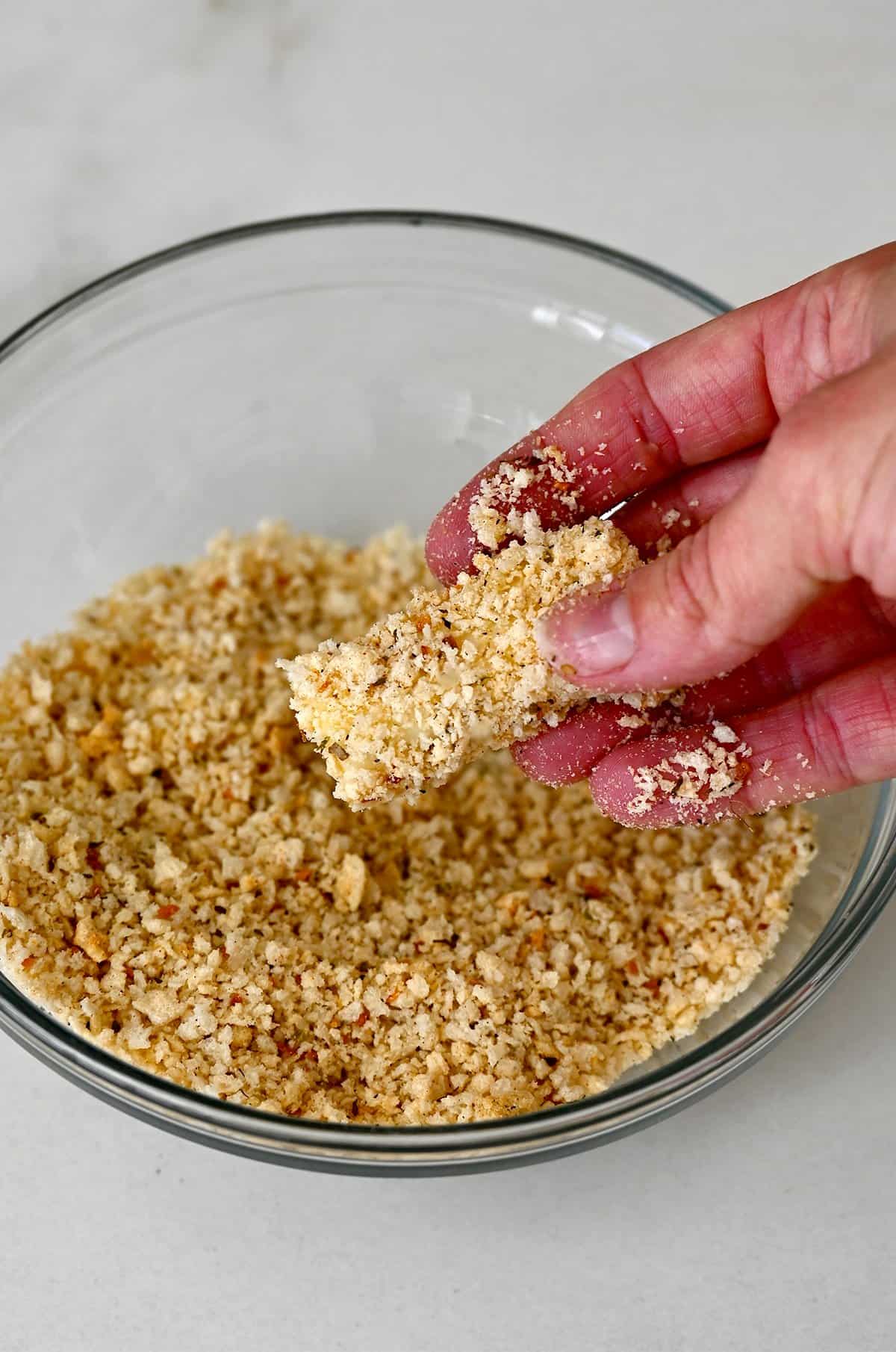 Then, after being coated in flour and egg, the mozzarella stick gets coated in panko breadcrumbs.