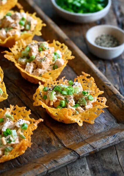 Creamy buffalo chicken salad tucked inside crunchy cheddar cheese cups.