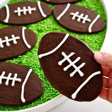 Chocolate football cookies with royal icing laces.