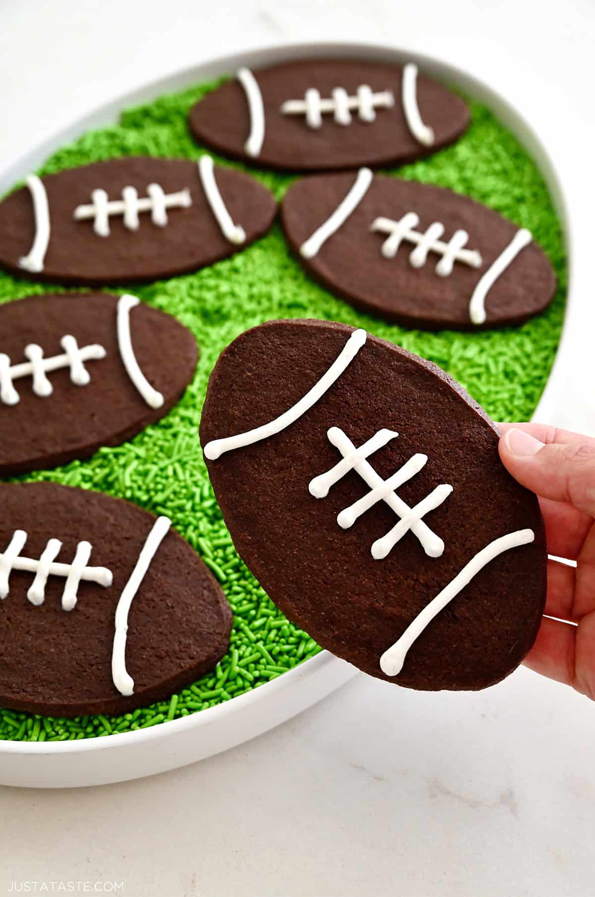 Chocolate football cookies with royal icing laces.
