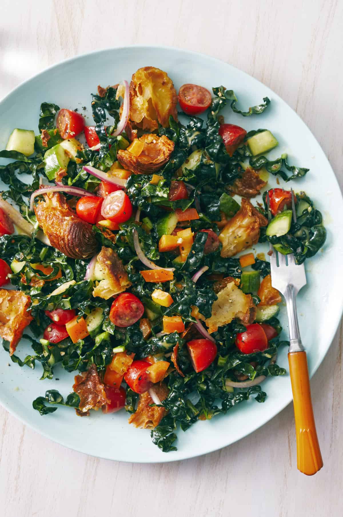 Kale panzanella salad with lemon Dijon dressing.