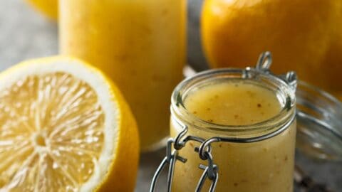 Homemade lemon vinaigrette salad dressing in a glass jar.