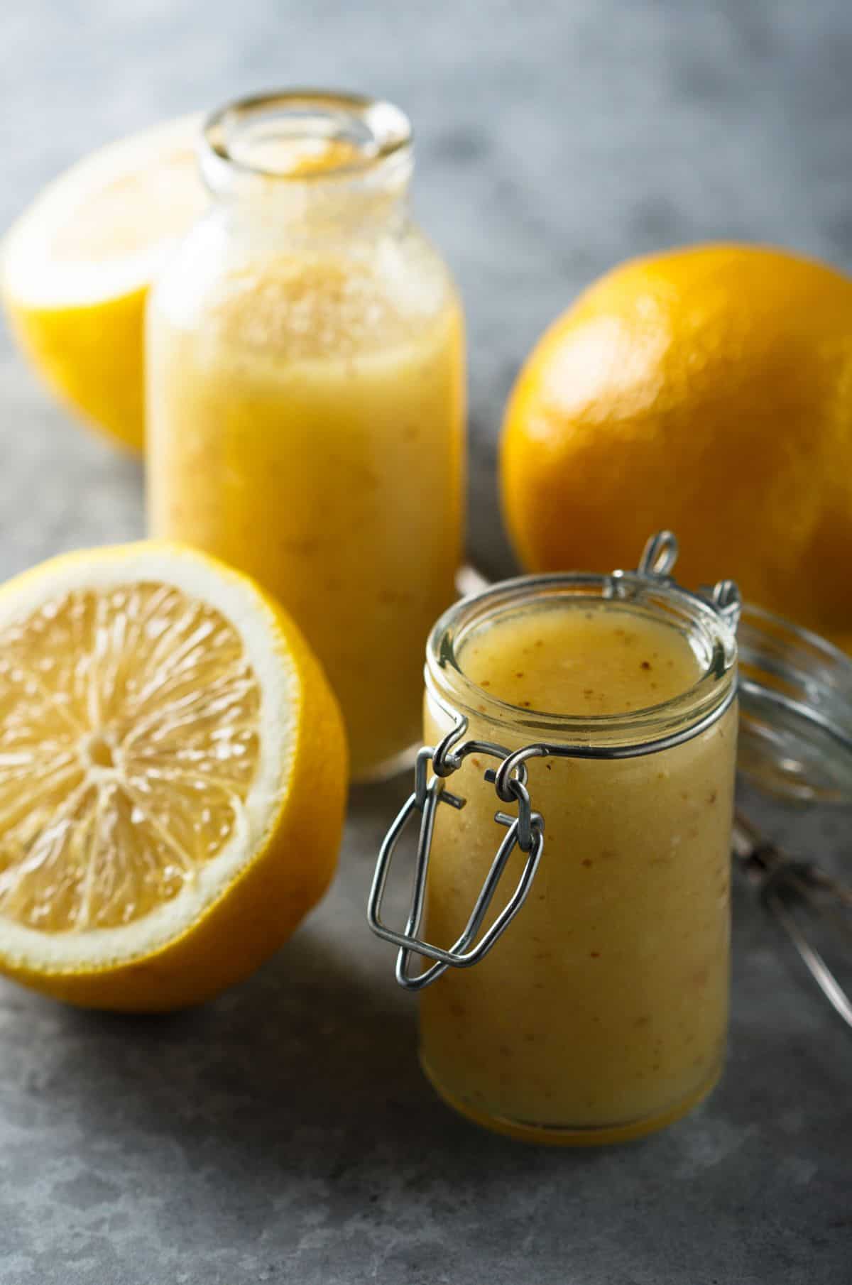 Homemade lemon vinaigrette salad dressing in a glass jar.