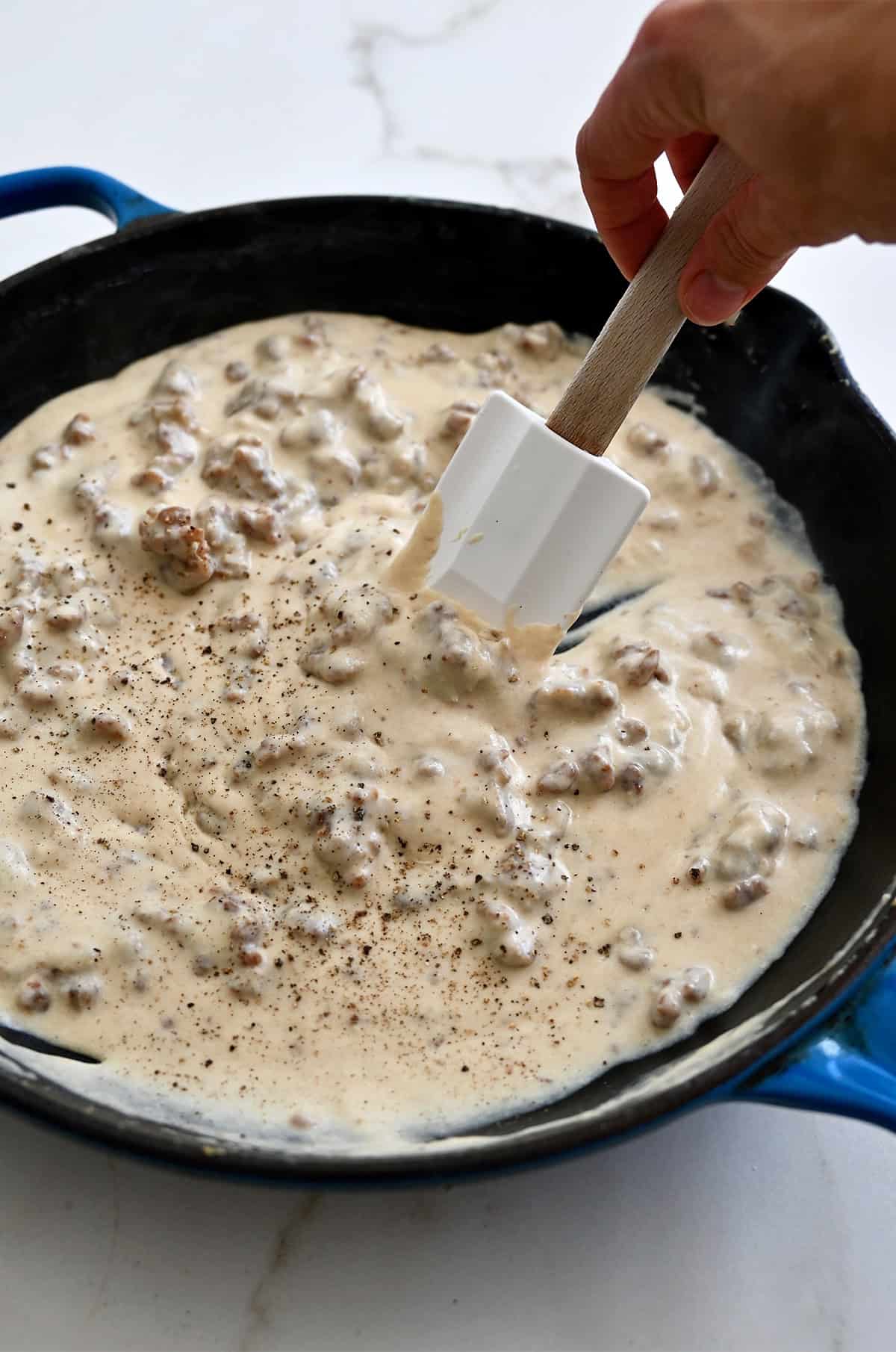 Homemade sausage gravy in a large skillet.