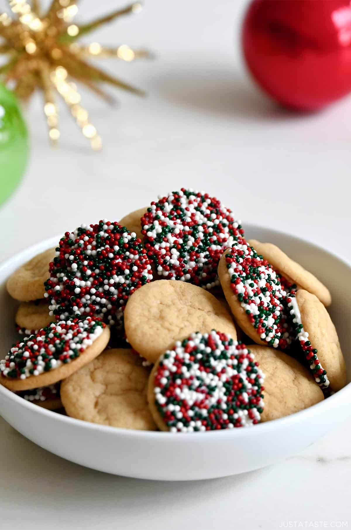 Chocolate chipless Christmas cookies with festive sprinkles.