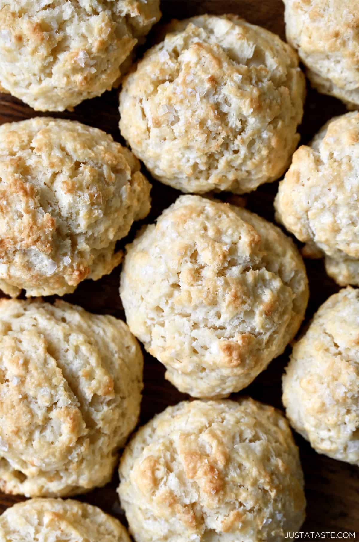 Golden brown easy drop biscuits touching each other.