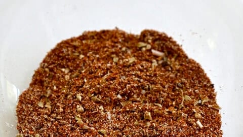 Homemade taco seasoning in a glass bowl.