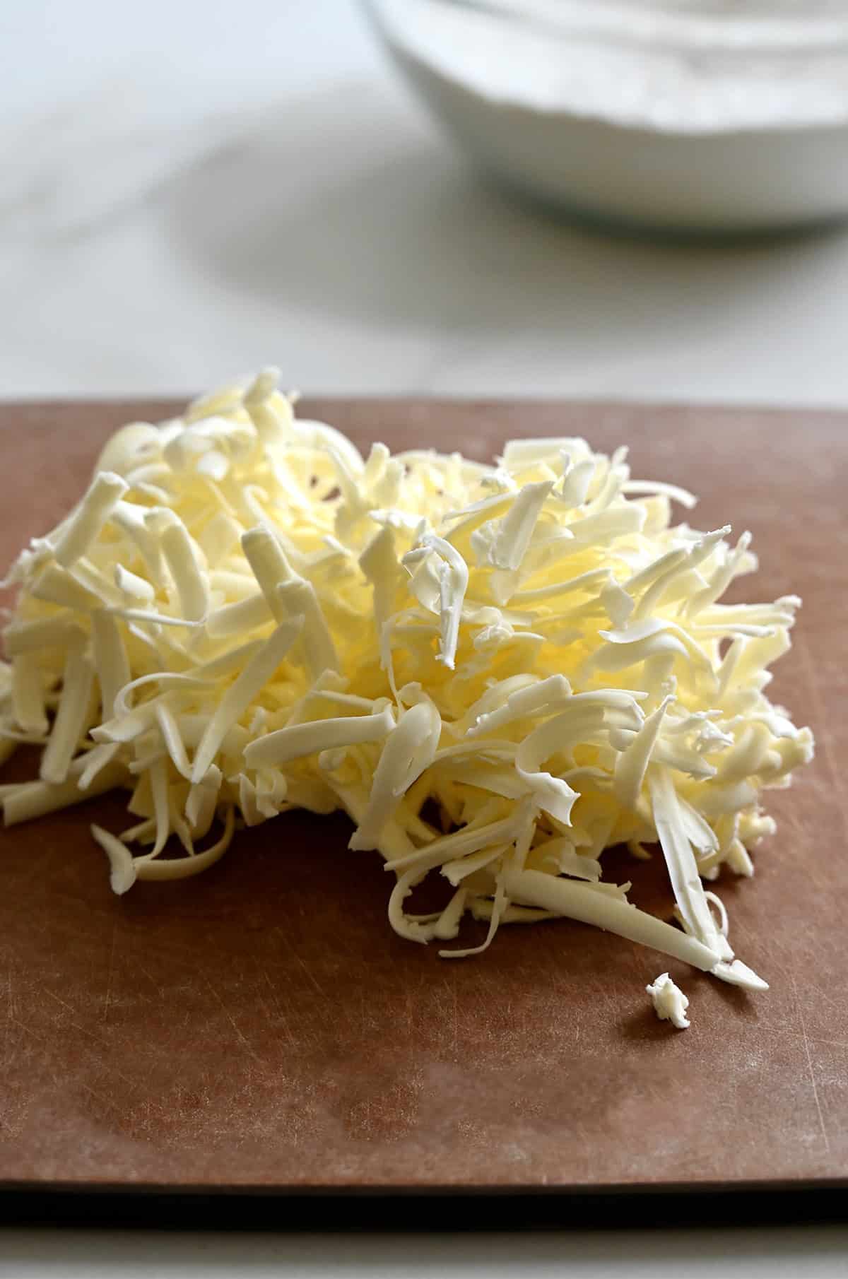Grated butter on a cutting board.