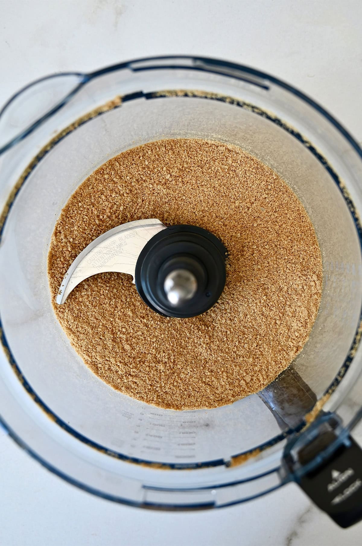 Crushed graham crackers in a food processor. 