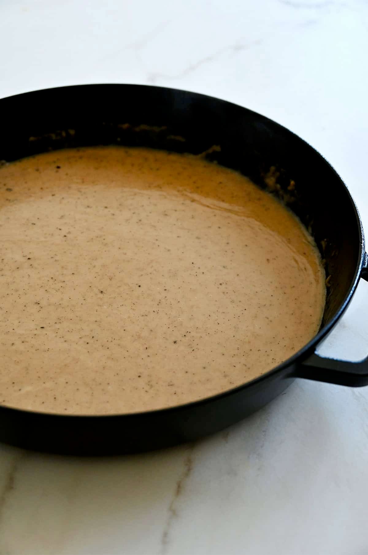 Lemon pepper pan sauce in a large skillet.