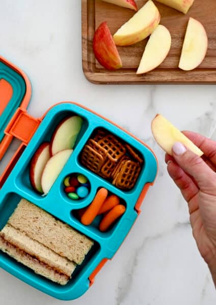 Sliced apples that haven't turned brown, tucked into a lunchbox.