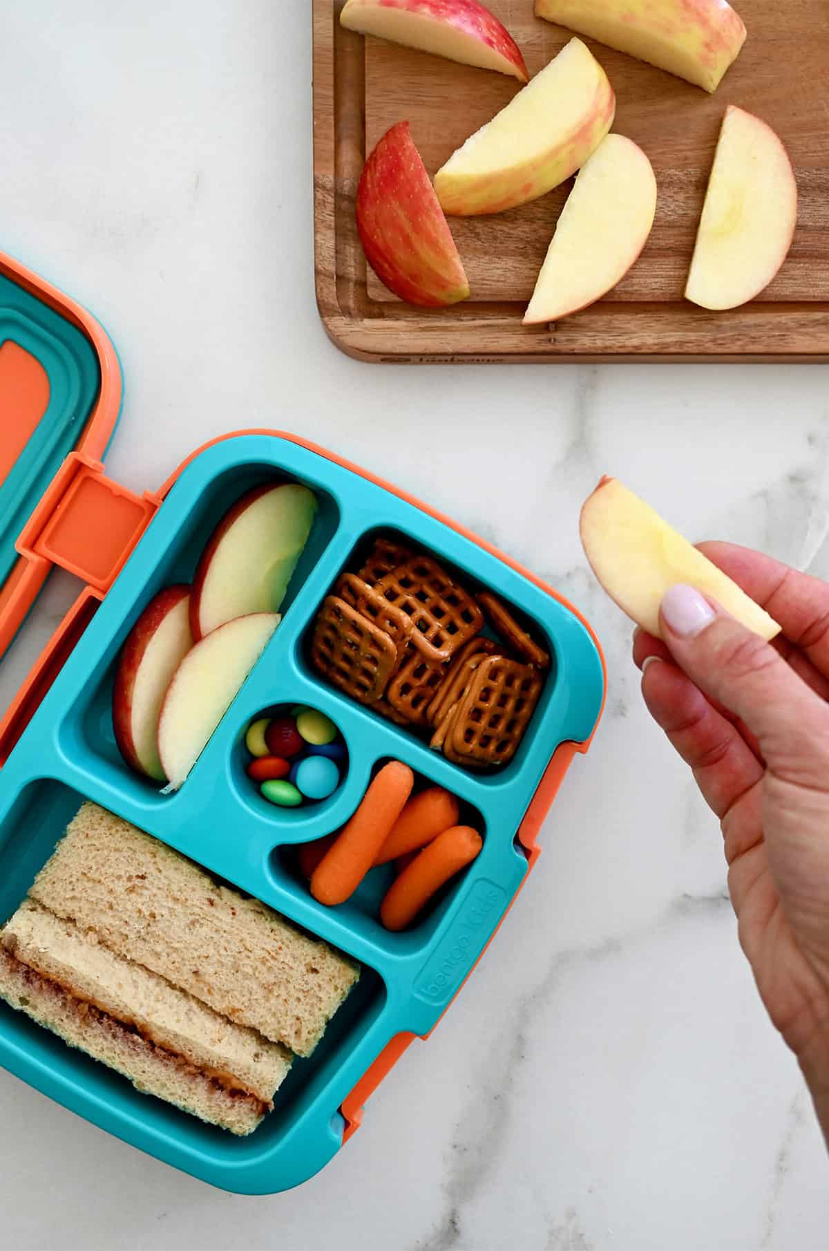 Sliced apples that haven't turned brown, tucked into a lunchbox.