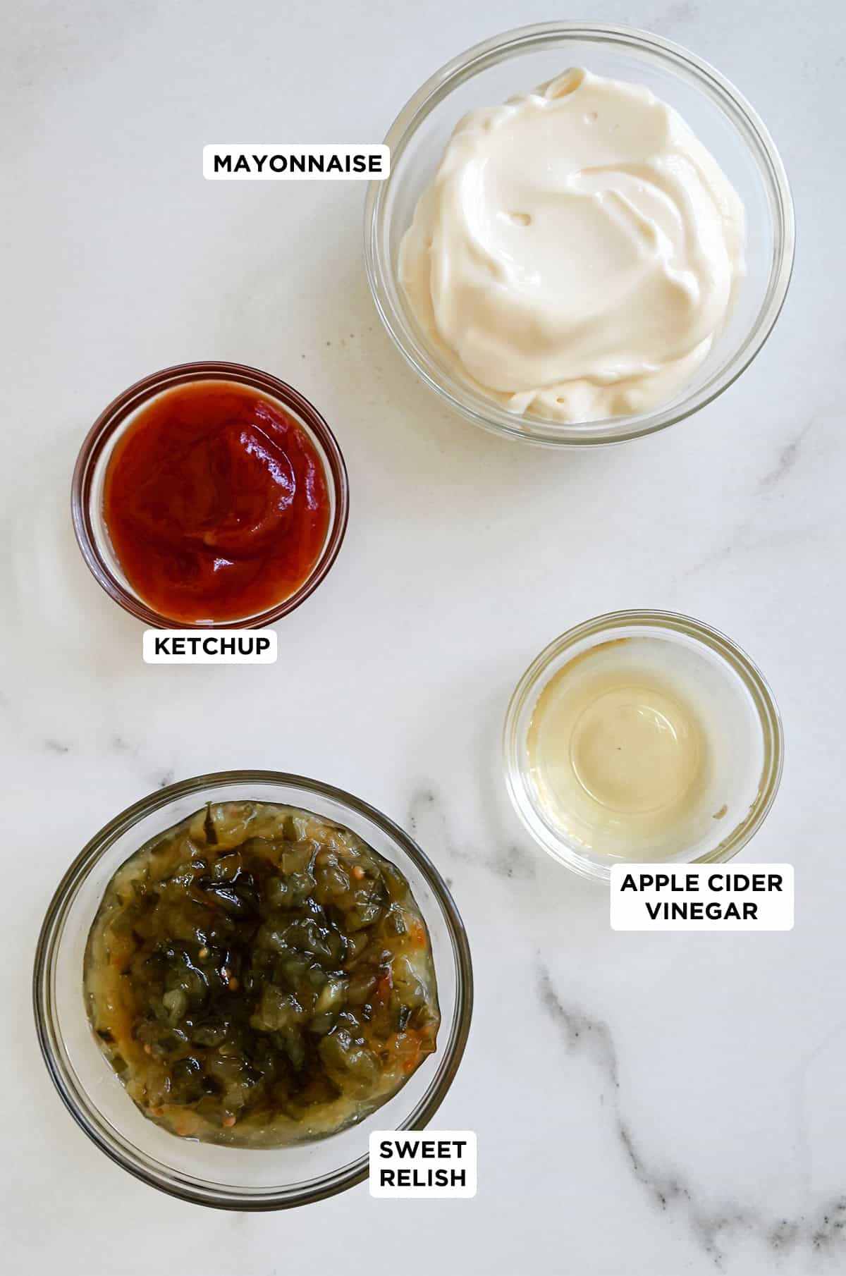 Ingredients to make burger sauce, sweet pickle relish, ketchup, mayonnaise and apple cider vinegar.