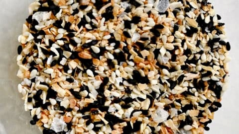 A homemade mix of everything bagel seasoning in a glass bowl.