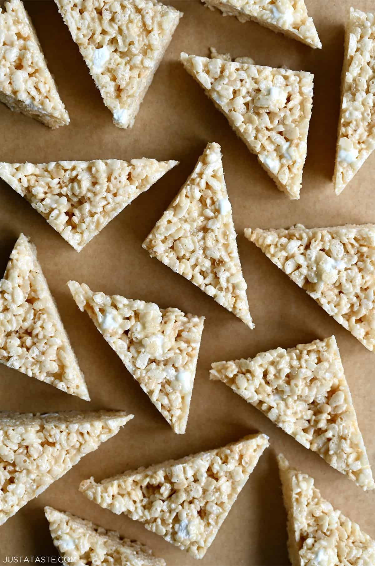 Gooey crispy marshmallow treats cut into triangles.
