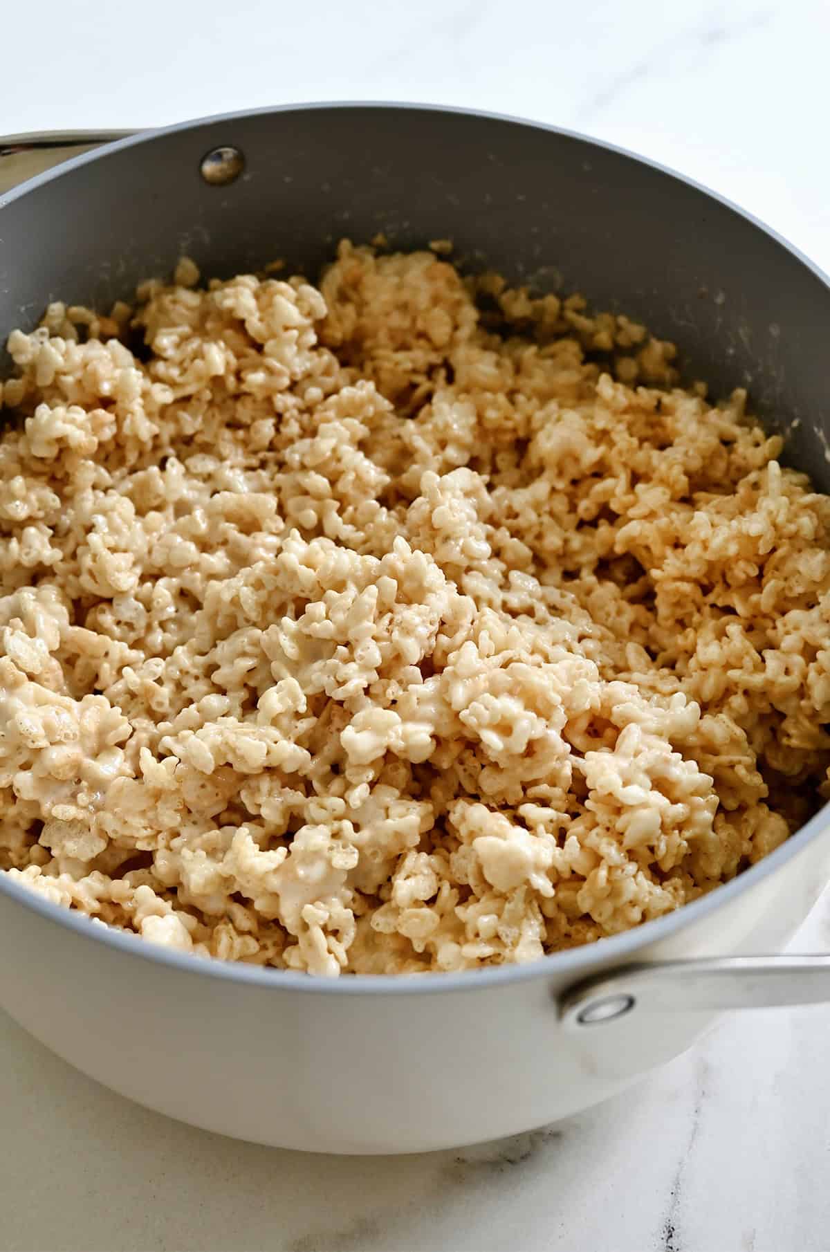 Rice crispy treats mixture in a stockpot.