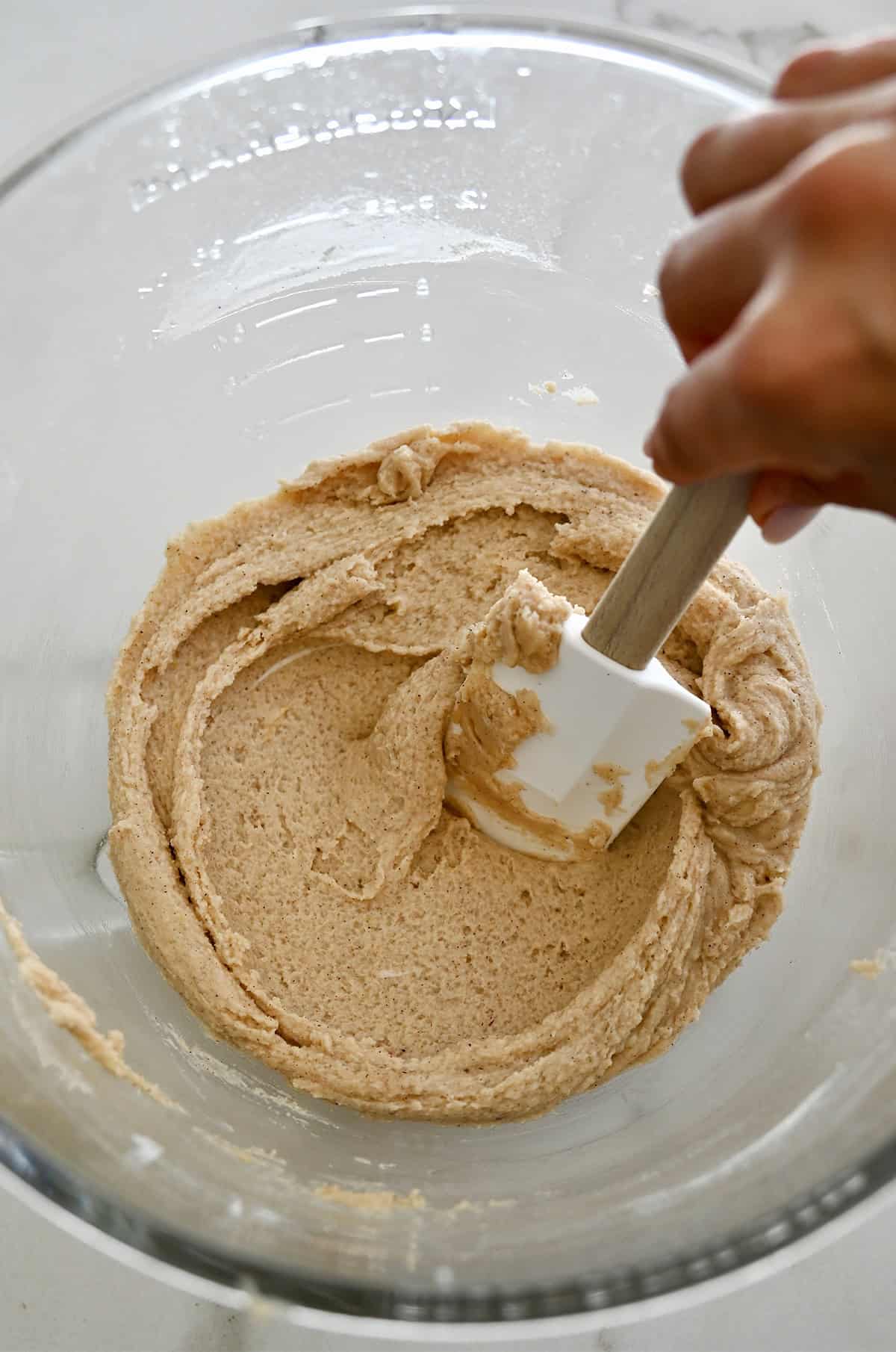 Chilled chai cookie dough in a glass bowl.