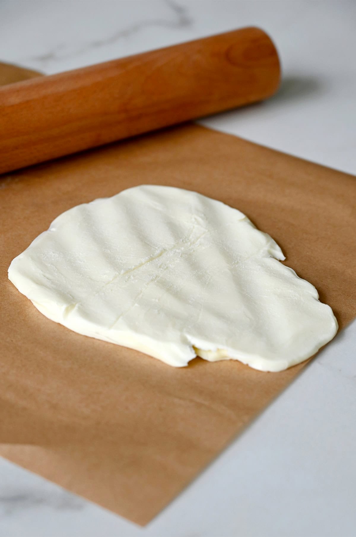 Butter that's been pounded flat with a rolling pin to quickly bring it to room temperature.