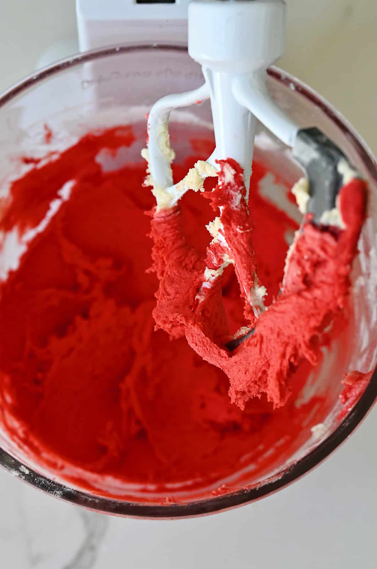 Spritz cookie dough dyed red with gel food coloring.